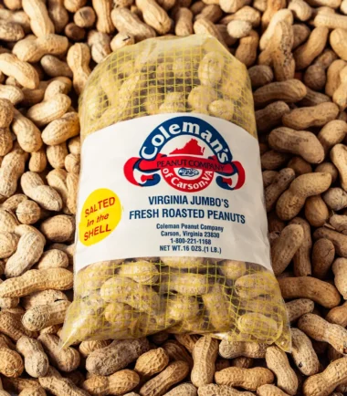 Bag of Coleman's salted in-the-shell peanuts on a bed of peanuts